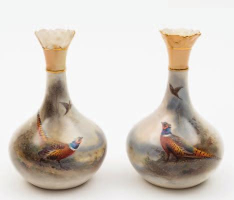 473 A pair of Royal Worcester porcelain vases by James Stinton of tear drop form each enamelled with a cock pheasant in a