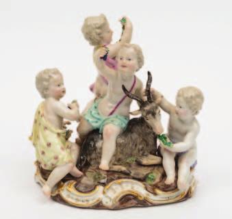 481 481 A Meissen porcelain allegorical group of two cherubs emblematic of Geography one holding a globe, the other a measuring instrument, on gilt scrolled mound base with tree stump support,
