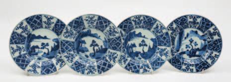 200-300 414 A pair of Chinese famille verte bowls each painted in green, aubergine, yellow and iron-red with four sprays of peony flowers and foliage within underglaze blue line borders, underglaze