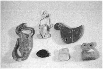 The uruk culture 129 Figure 5.6 Amulets and pendants worn in the Late Uruk age.