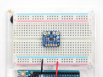 Add the breakout board: Place the breakout board over the pins so that the short pins poke through the