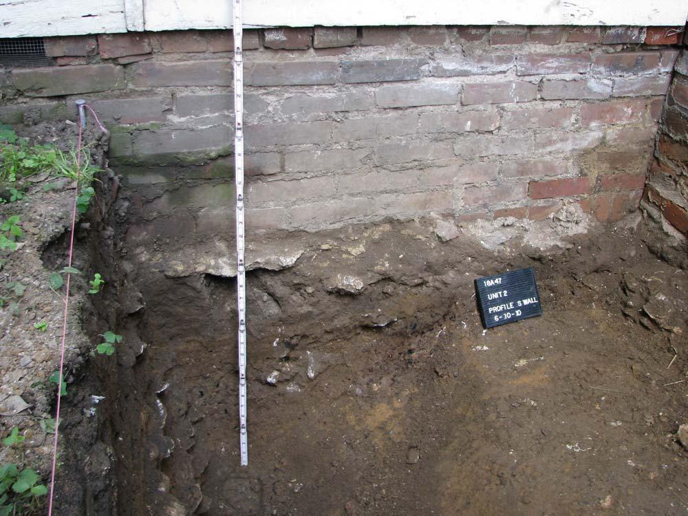 later brick foundation (Figure 14). Figure 14-Unit 2, South Wall Profile, Feature 9 removed.