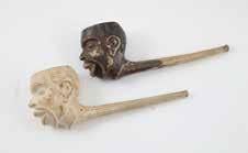 carved with insect and pipe carved with young boy in adult dress with dog (faults) 757 Ivory Long Length Cigarette Holder carved with dragons, with opium pipe and modern Meerschaum pipe