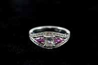 set central cushion cut, two princess cuts with six shoulder diamonds tdw approx 1.