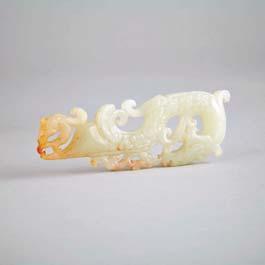 127 Archaistic White Jade Dragon Pendant Rendered in the form of a sinuous dragon with a smaller beast