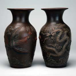 and fauna on each of the tall rising sides, one vase with 10 cm hairline crack, height 12.8 32.