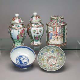 1 23 80 Four Famille Rose Porcelain Items Including: a pair of jars and covers, tea caddy,