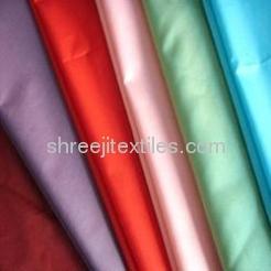 Satin Fabric 120GSM Polyester Satin Fabric is Lustrous and shiny fabric generally used in making elegant dresses, bridal and wedding wear, lingerie and bedding. Our compa.