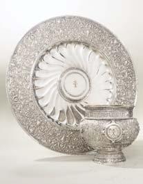 Also by Garrard is King George I s silver banqueting service. This is being sold in various lots and includes a number of unusual basket-shaped double salt-cellars (estimates from 500-1,500).