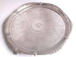 central Coat of Arms surrounded by decorative etching, by Mappin & Webb, 1883, 14 ins diameter, 810g, 600-1000 133 134 George III Cork silver serving spoon with Old Irish point bright cut handle