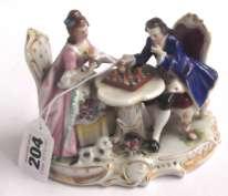 100-200 Richly decorated Chelsea Porcelain group of a Lady with a lamb, and Gentleman, in