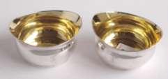 83 87 84 Pair of George III Irish silver tub shaped salt cellars with gilt interiors and crests