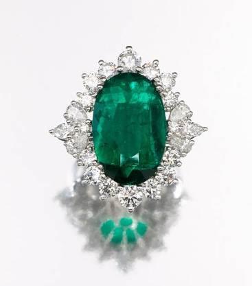 green hue. Adorned by pear-shaped and brilliant-cut diamonds together weighing 2.