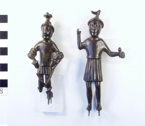 14 The figure is certainly holding a trident and although Neptune is not a particularly common subject for small bronzes, and this would be the only such figurine from Britain, he does appear in