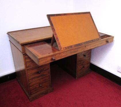 style desk with sloping top, centre drawer & leather