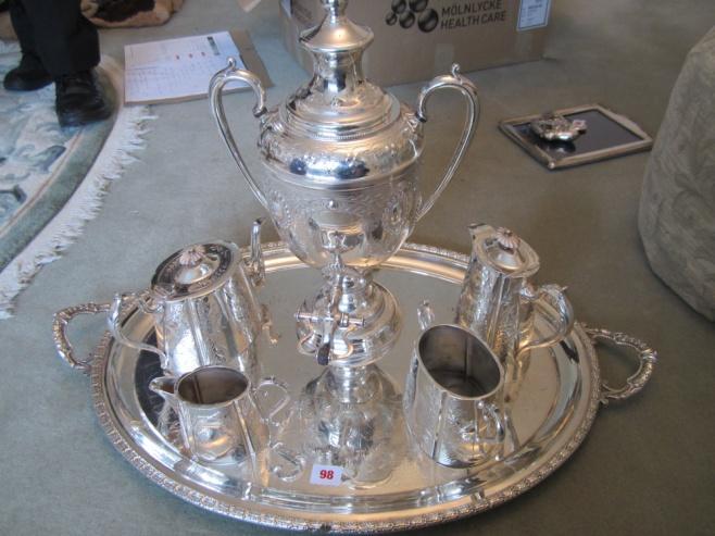 plated hot water teapot, sugar bowl, and milk jug on large