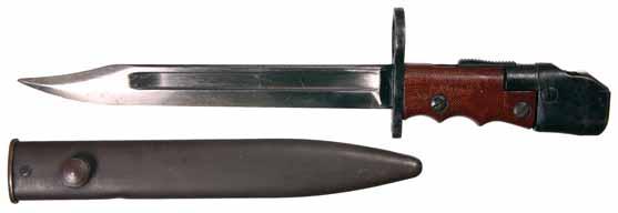 3980* No 7 Enfield Jungle carbine bayonet, 1948, 8" blade length, fluting down each side of the blade, large muzzle ring, toggle slide for placement on barrel or under fore-grip, original wooden