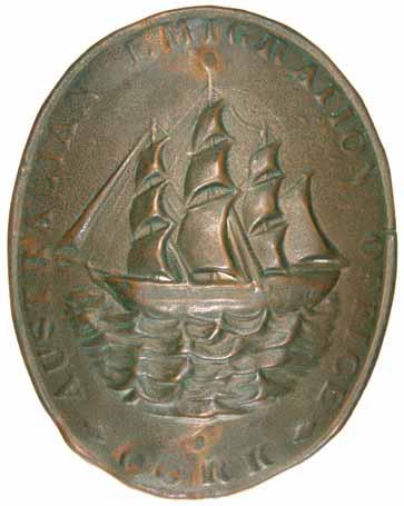 MISCELLANEOUS 4083* Ireland, Australian Emigration Officer's badge, Cork, circa 1840s, thin brass badge embossed with sailing ship on ocean and lettering on the outer edge 'Australian Emigration
