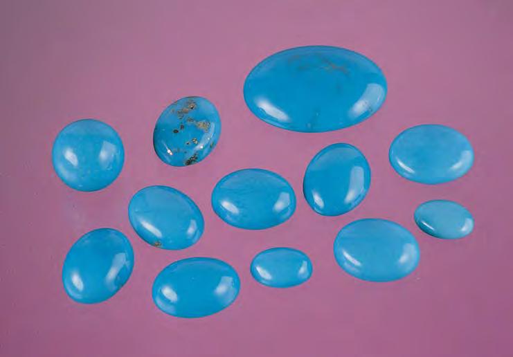 Figure 23. These turquoise cabochons were treated by the Zachery process, which decreases the porosity of the material, making it less likely to discolor with time and wear. Photo by Maha Tannous.