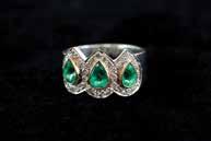 Ring Art Deco panel design with central emerald and diamond surround 16 Ins $5,400