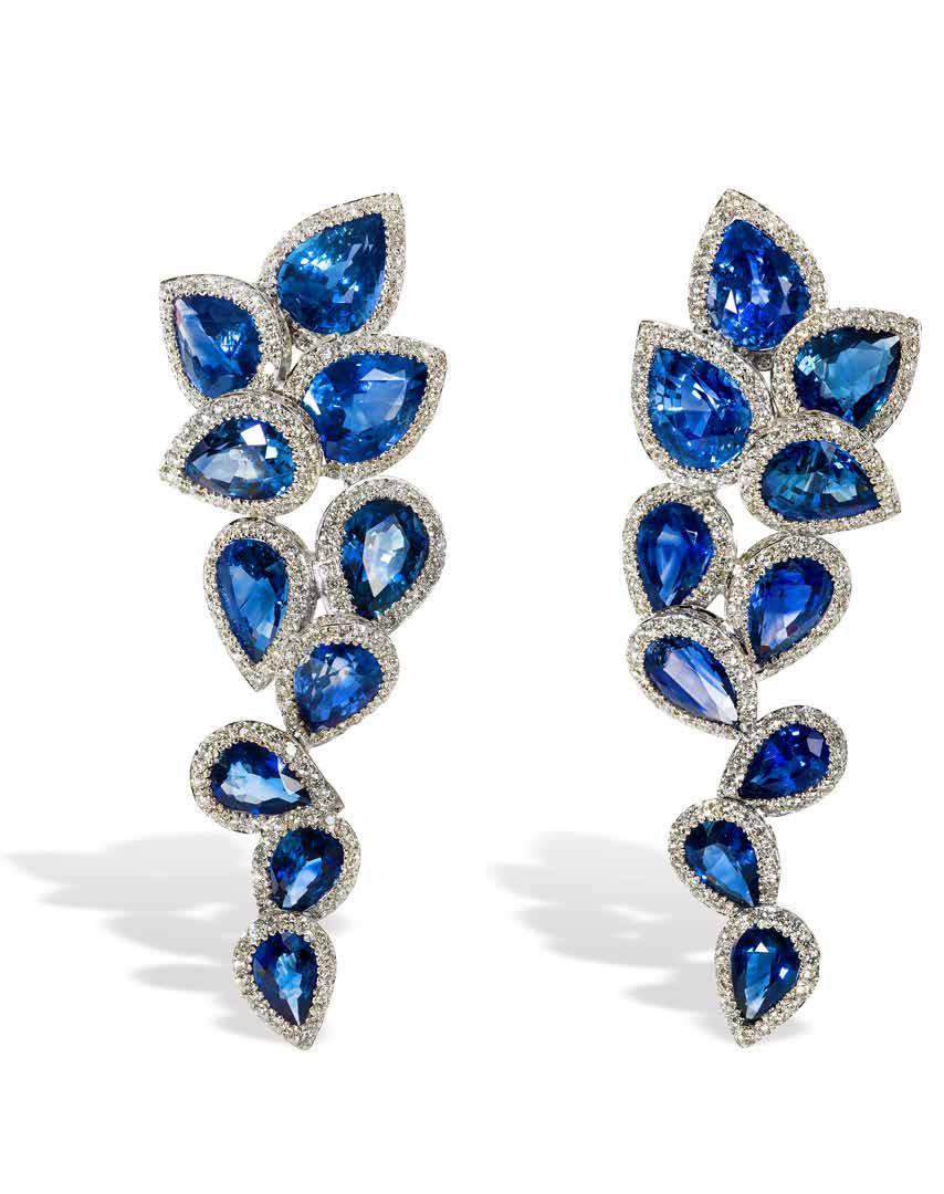 These pear cut sapphire drop earrings can also be worn short (with the first four gems) and are made with white gold, Ceylon blue sapphires and diamonds.