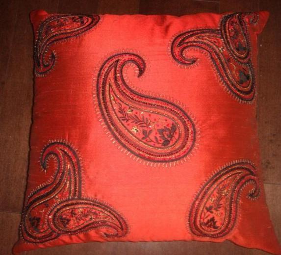 Beaded and sequined pillow with paisley motif in silk dupion by the designer