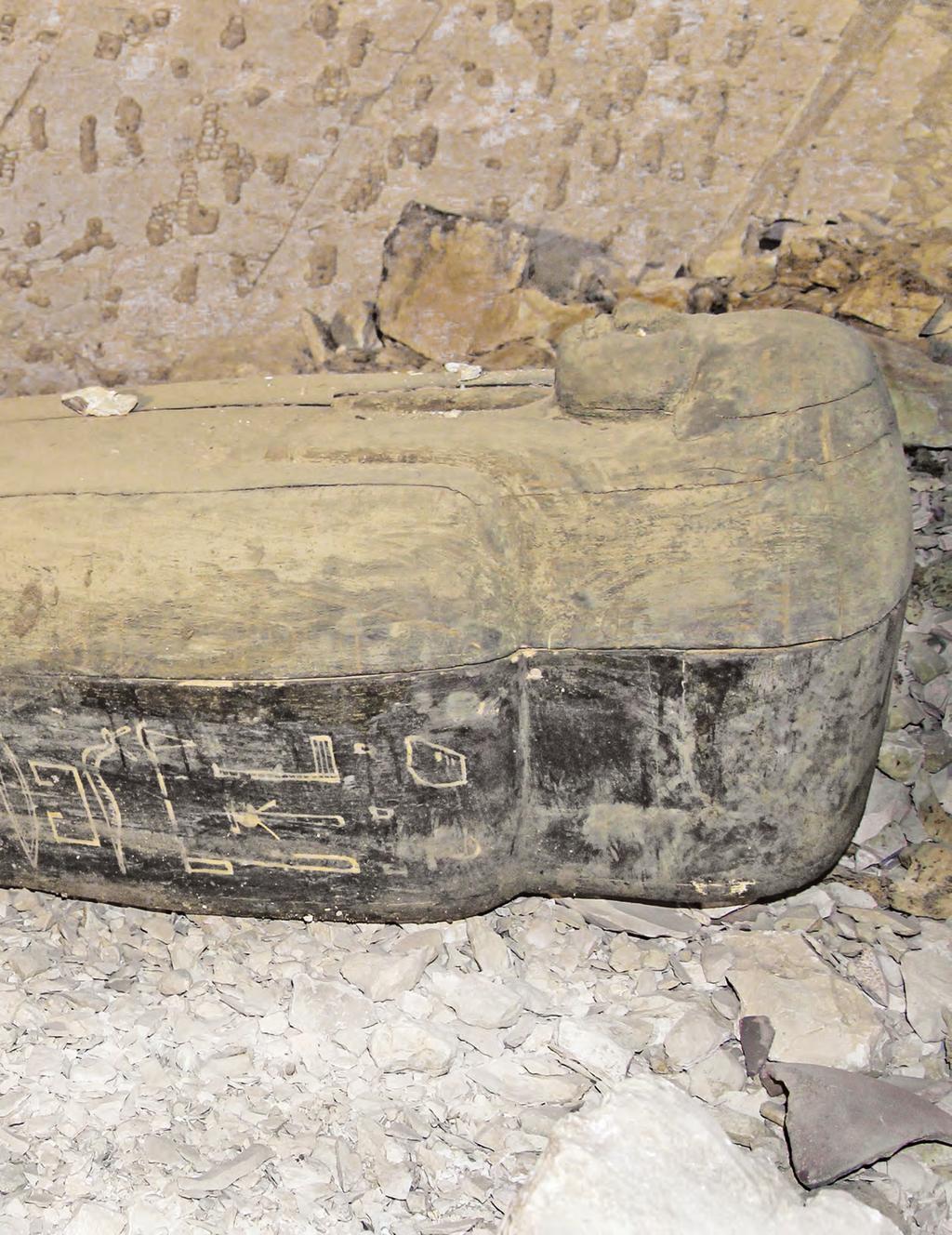 View of the interior of KV64, with the incribed wooden coffin of the tomb s occupant, Nehemes-Bastet, a small funerary stela at its foot end.