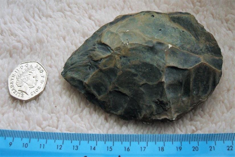 Item:10 Brief Description: Hand Axe This is a Palaeolithic hand axe dating from 30,000 BCE [BC]. The original item was found at a site in Wales.