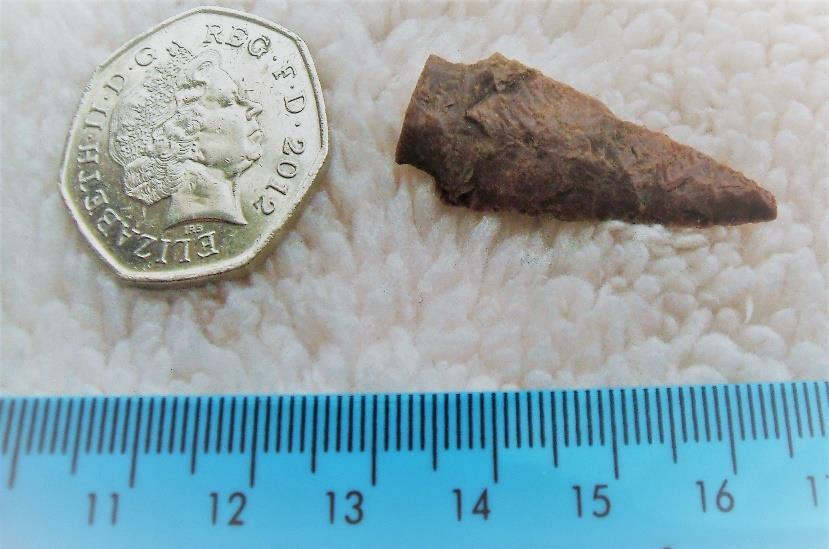 Item:14 Brief Description: Bronze Age Arrowhead This flint arrowhead is an original Bronze Age arrow not a replica.