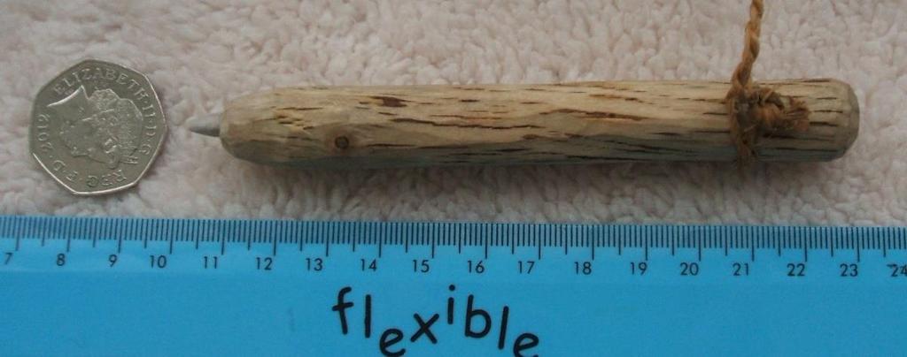 Item: 2 Brief Description: Flint Retoucheur The tip of this tool was made from antler and the handle is lime wood. The inner bark of the lime tree was used to make the cord.