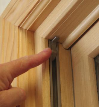 Cleaning Your Double-Hung Windows The first thing to do to clean your windows is to raise the bottom sash. At the top of the window, inside the track, you ll find a plastic clip on each side.