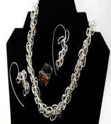 Sterling Silver necklace-$600, Matching wavy loop earrings-$200