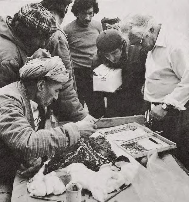 Afghan archaeologists and Russian archaeologist Victor Sarianidi investigate artifacts found from the burial site of Tillya Tepe, 1978. Photo copyright Viktor Sarianidi. Reproduced with permission.