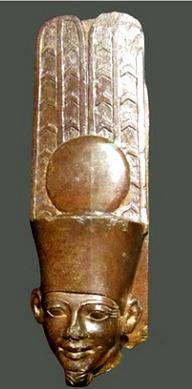 height of the statue is 0.435 m and the designer showed the owner wearing a short Schenti (the legs are necked), a Khat headdress with hands above his knees.. Fig.