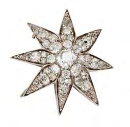 26cts 700-1,000 54 A late Victorian diamond set star brooch of traditional design, set with a central cushion cut diamond, and throughout with graduated old round and cushion cut diamonds, to a
