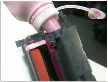 Once the plug is removed, place it somewhere safe and dispose of any toner left