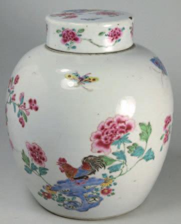 A Chinese porcelain rouge pot and cover of circular form finely enamelled with a single bird and cricket on bamboo amongst flowers and grass within a ryui head border, 7 cm diameter, four character