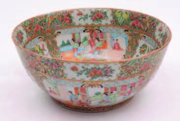 560. A Cantonese porcelain punch bowl enamelled to the exterior and interior with panels of figures in garden pavilions alternating with song birds, butterflies flowers and foliage reserved on a