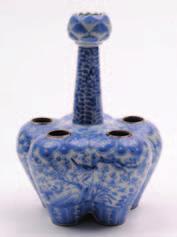 A Chinese porcelain garlic shaped vase decorated with sang de bouef glazes, the interior of the neck graduating to purple hues, 52 cm high, mid 19th century. 200-300. 562.
