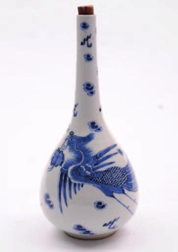 564. A Chinese porcelain bottle vase of pear shaped form painted in blue with a phoenix supporting a bound casket in it s beak amongst cloud scrolls and lightning, 25 cm high, two character