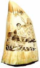 *92. LARGE SCRIMSHAW TOOTH WITH A SCENE DEPICTING A SHIPWRECKED SAILOR. Nice broad tooth measuring 3 3/4 wide x 6 3/4 h.