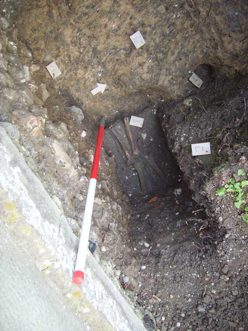Plate 2: burial F4 and foundation F1 in Test-hole 1, view south-west. 6.