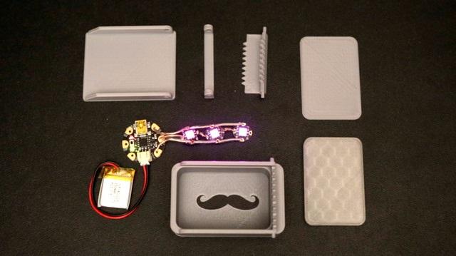 Overview Light up the scene with this stylish 3D Printed LED belt buckle! This is a 6 piece design that uses GEMMA and three NeoPixels to illuminate the 3D Printed cover.