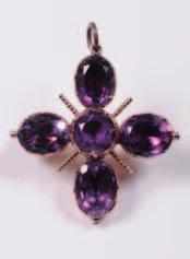 A mid 19th century gold and foiled amethyst pendant/ brooch