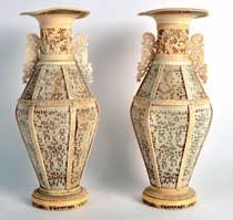 78 A FINE AND RARE PAIR OF MID 19TH CENTURY CHINESE CANTON IVORY BASKETS AND COVERS of large proportions, finely carved with figures standing within landscapes, the handles formed with figures