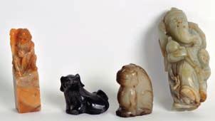 Lot 220 220 A SMALL EARLY 20TH CENTURY CHINESE CARVED MUTTON JADE FIGURE OF A CAT together with a carved jade scholar, a soapstone