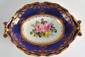 Lot 372 373 A PAIR OF ROYAL CROWN DERBY CIRCULAR PLATES C1902 painted by Cuthbert Gresley, decorated with three roses and floral sprays under a blue