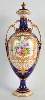 389 AMERICAN SILVER AND ENAMEL CLOCK by The Webb C ball of Cleveland, decorated with floral scrolls, fitted case. 3.5ins high.