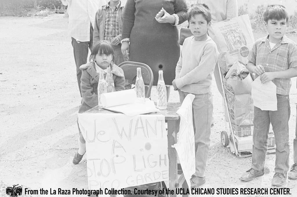 Children petition for a traffic light at the corner of Fourth Street and Pecan Street in Los Angeles La Raza photograph collection.