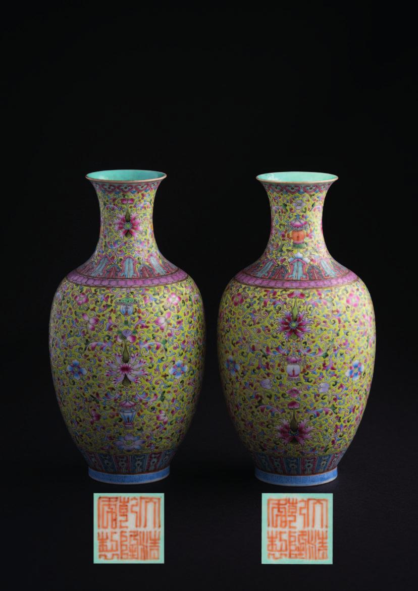 567 A pair of Chinese eggshell porcelain lime-green ground vases each of ovoid form with waisted neck and everted rim, finely painted with lotus blooms and leafy strapwork and other flowers, reserved
